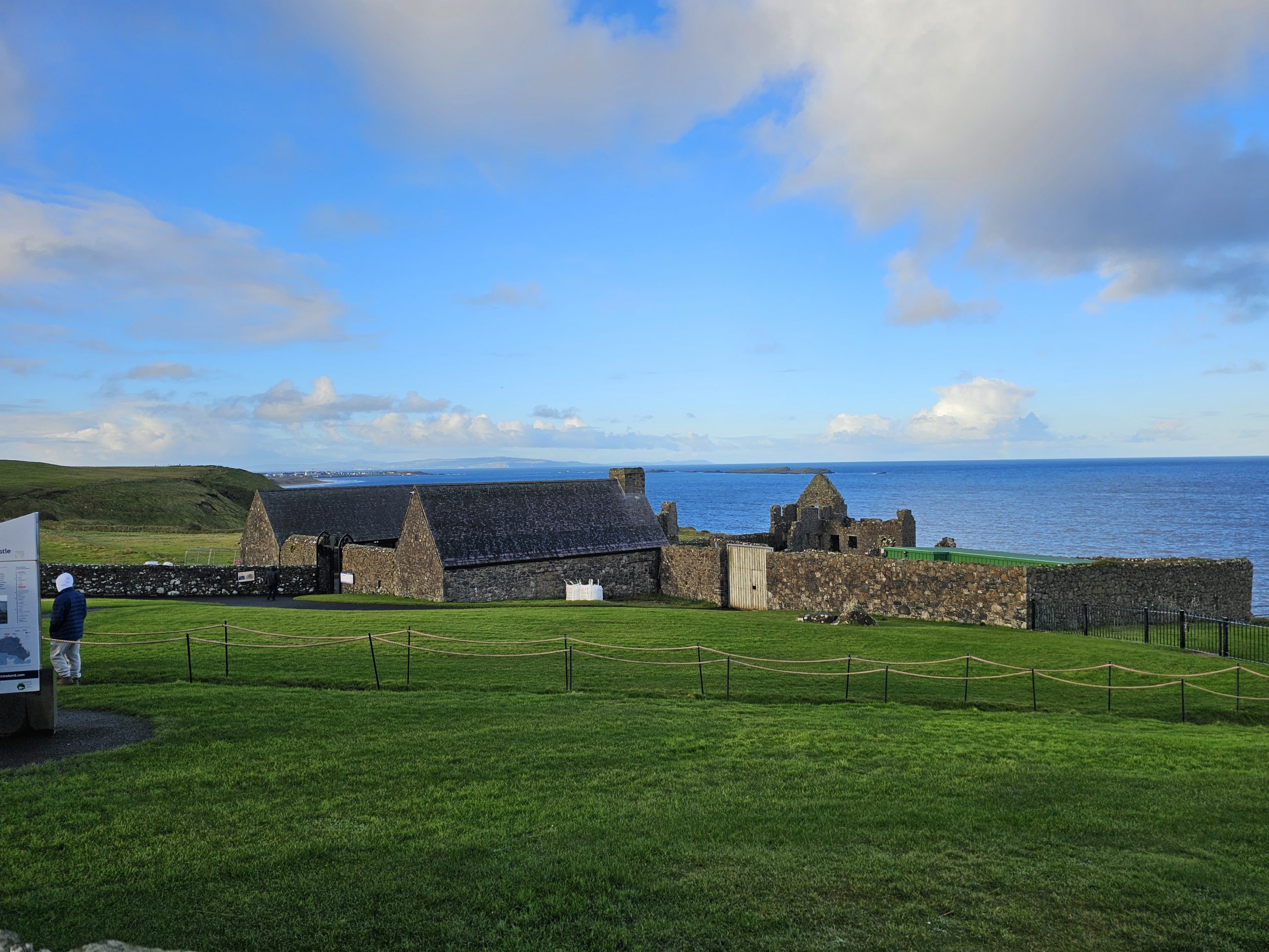 The lush fields and historic castles of Ireland overlooking the ocean